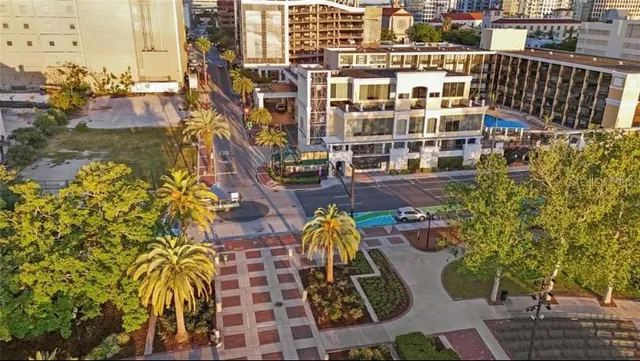 a view of a swimming pool with outdoor seating
