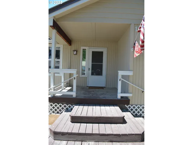 a view of living room with furniture and window
