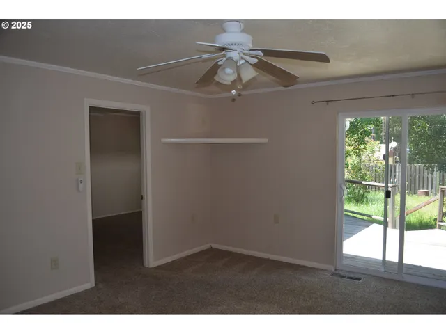 a picture of an empty room with a window