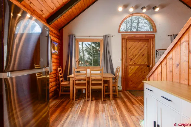 a view of front door with furniture and a window