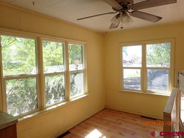 21196 Lanning Road Austin, CO 81410 - Photo 12 of 12 a view of an empty room with wooden floor and a window