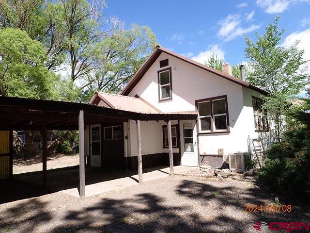 21196 Lanning Road Austin, CO 81410 - Photo 4 of 12 a front view of a house with a yard