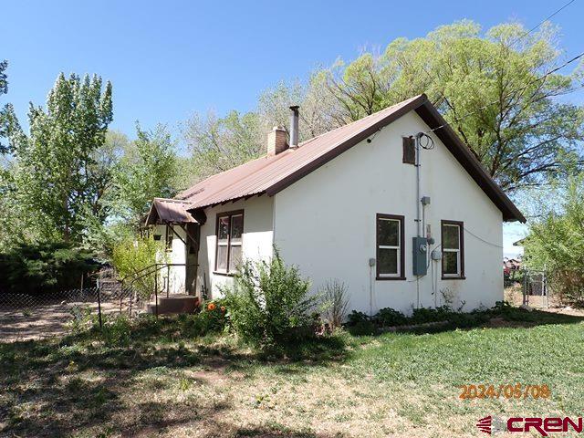 21196 Lanning Road Austin, CO 81410 - Photo 7 of 12 a view of a house with backyard and garden