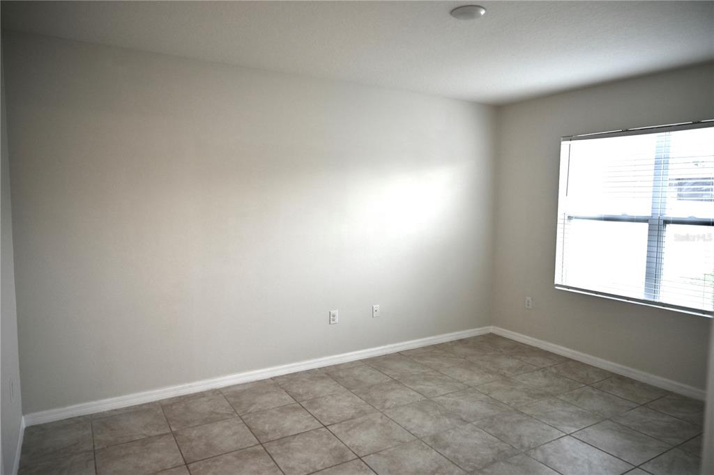 1036 Bethpage Road Auburndale, FL 33823 - Photo 14 of 18 an empty room with a window