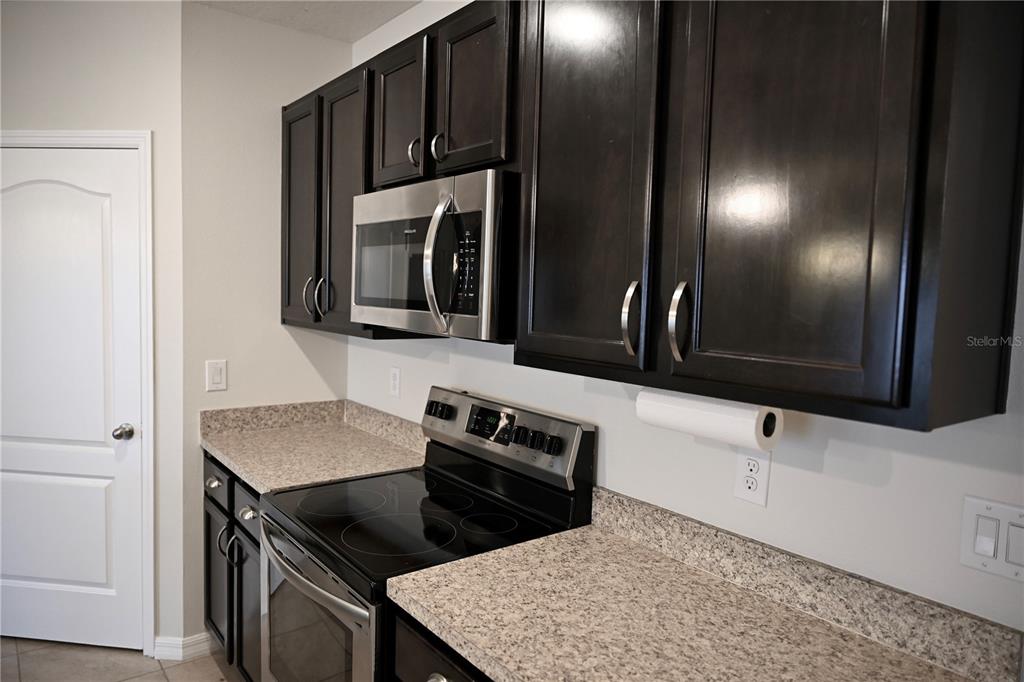 1036 Bethpage Road Auburndale, FL 33823 - Photo 5 of 18 a kitchen with a sink and cabinets