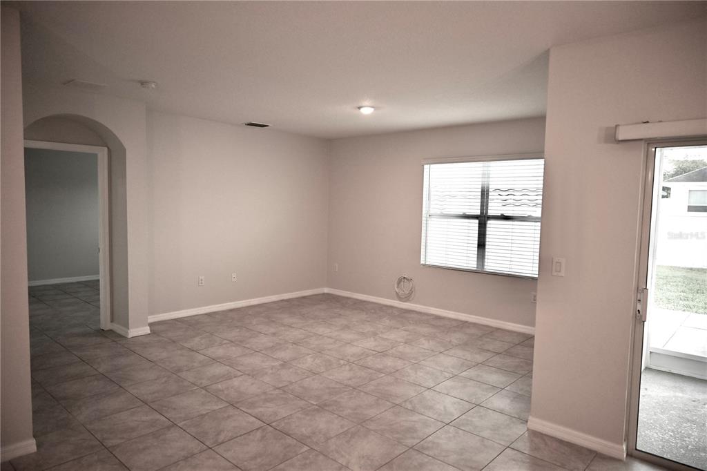 1036 Bethpage Road Auburndale, FL 33823 - Photo 10 of 18 an empty room with windows and closet