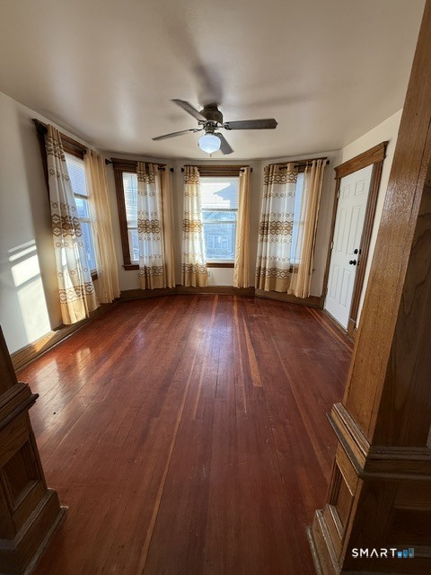 91 Alma Street Waterbury, CT 06705 - Photo 1 of 1 a view of an empty room with wooden floor and a window