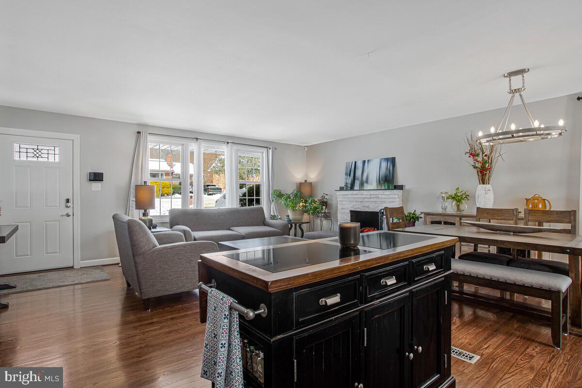 6617 Northgate Parkway Clinton, MD 20735 - Photo 13 of 36 a living room with furniture a fireplace and a table