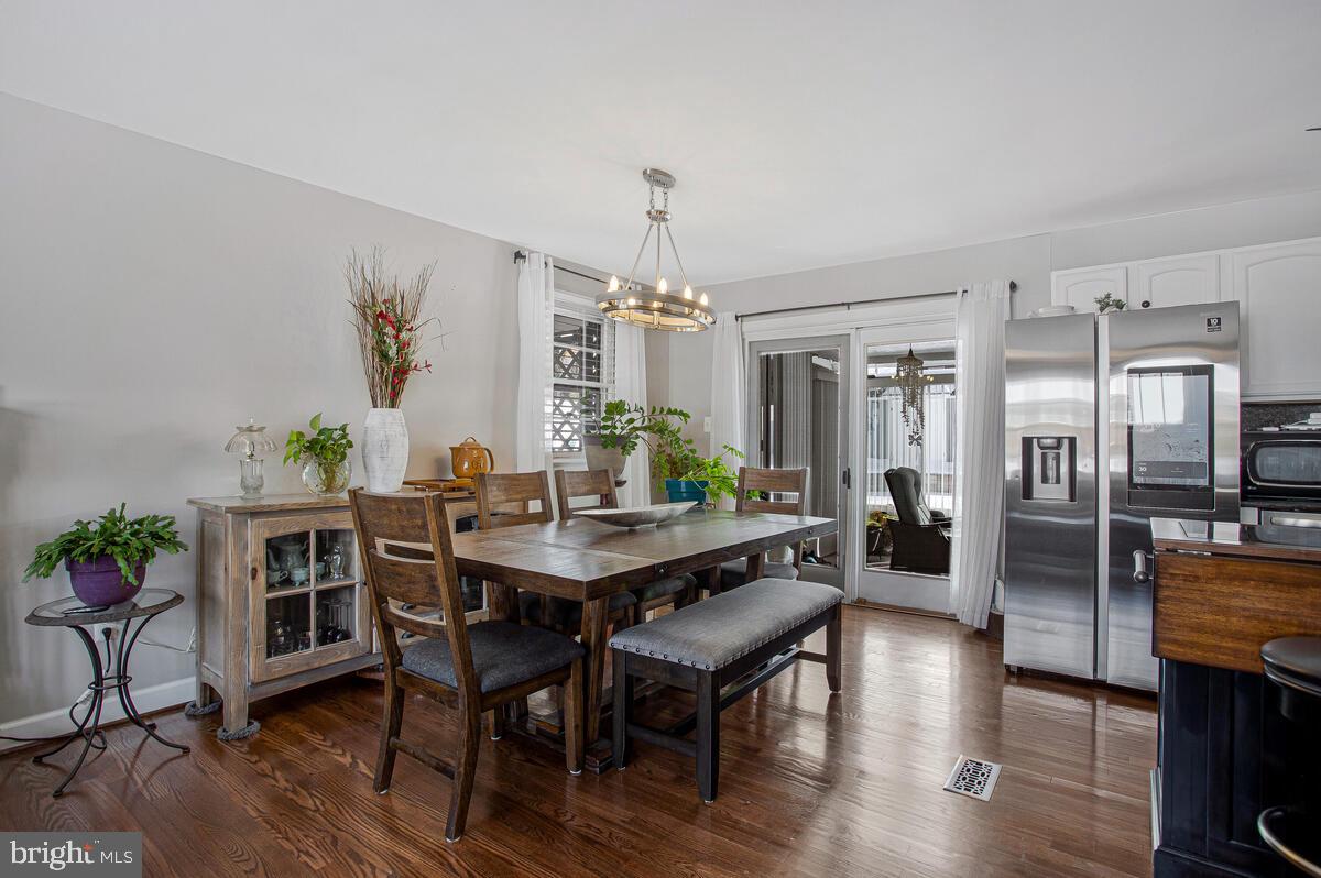 6617 Northgate Parkway Clinton, MD 20735 - Photo 7 of 36 a view of a dining room with furniture window and wooden floor
