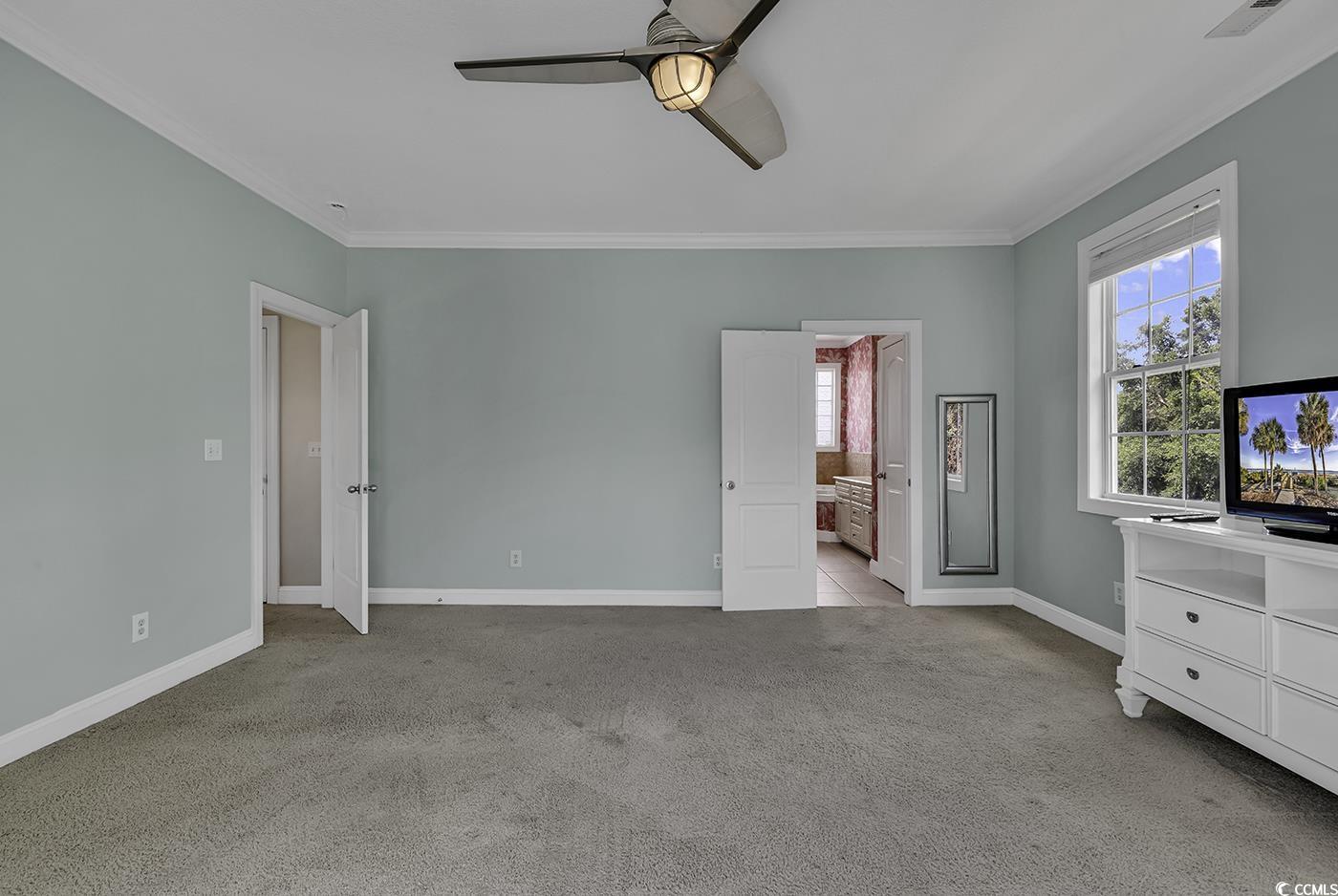 6 Cottage Drive Murrells Inlet, SC 29576 - Photo 16 of 31 Carpeted bedroom featuring ceiling fan, ornamental molding, and access to outside