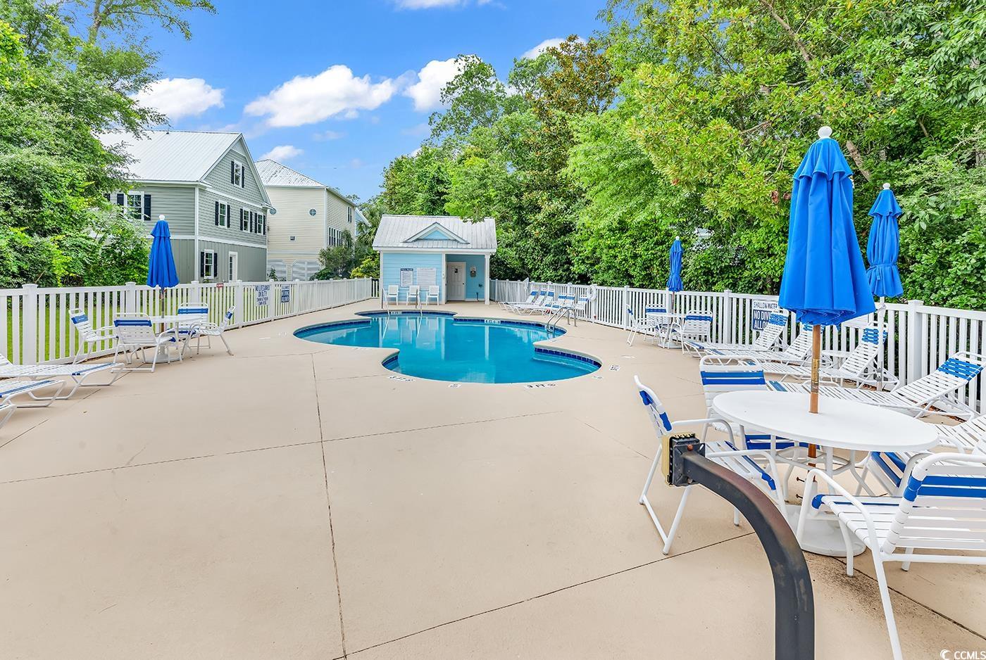 6 Cottage Drive Murrells Inlet, SC 29576 - Photo 2 of 31 View of swimming pool featuring a patio area and an outdoor structure