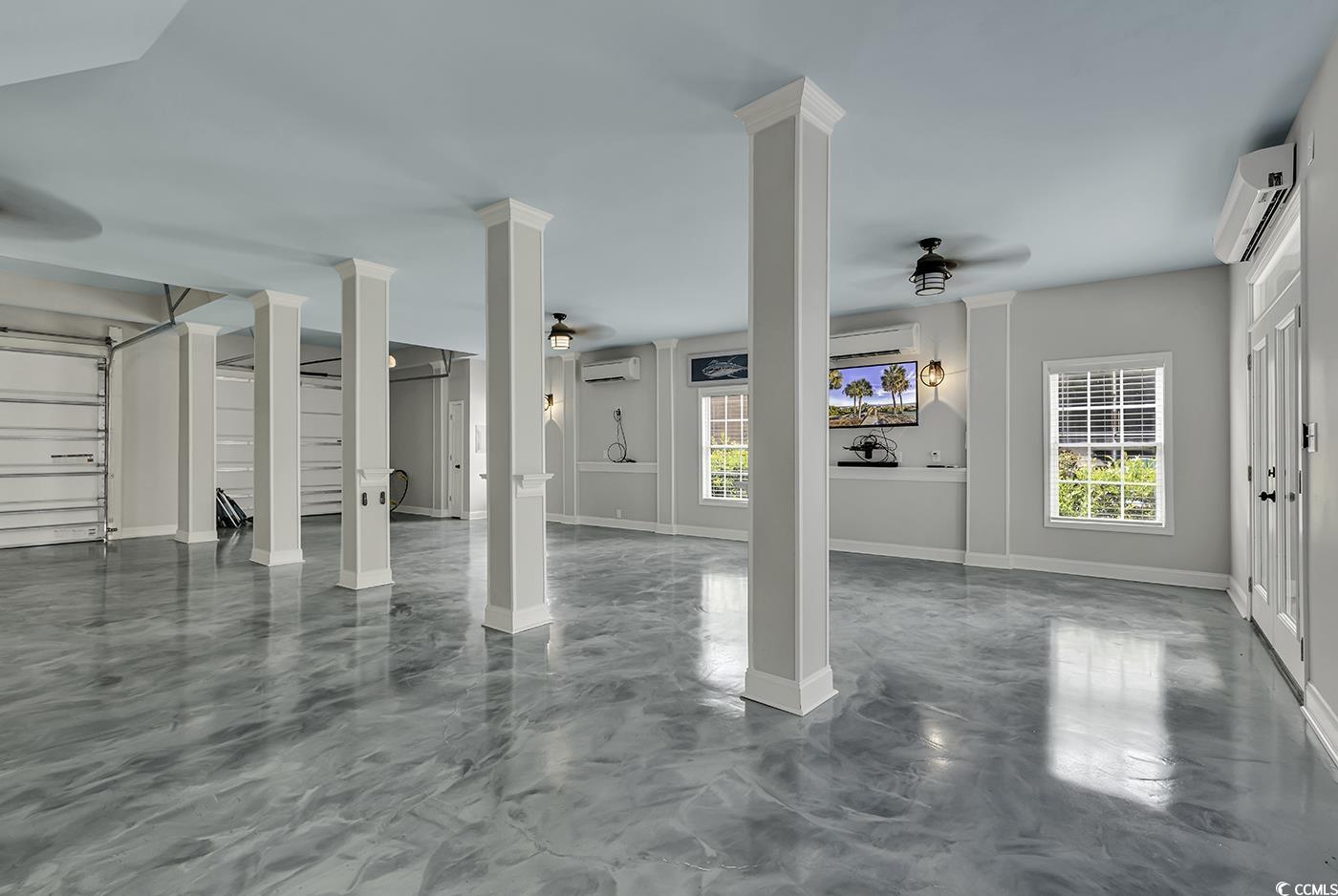 6 Cottage Drive Murrells Inlet, SC 29576 - Photo 25 of 31 Garage featuring a wall mounted AC and a garage door opener