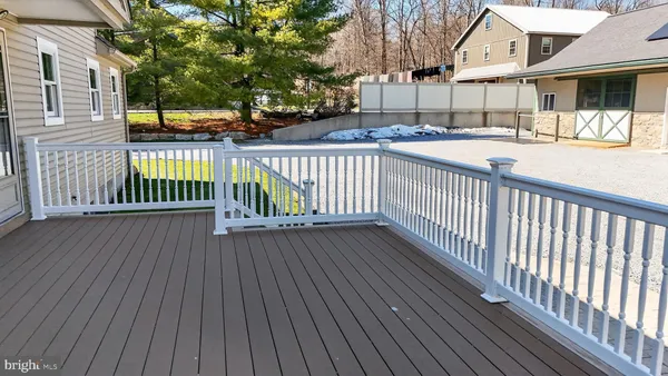 a view of a house with wooden deck