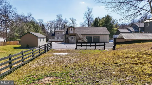 a view of house with swimming pool yard and outdoor seating