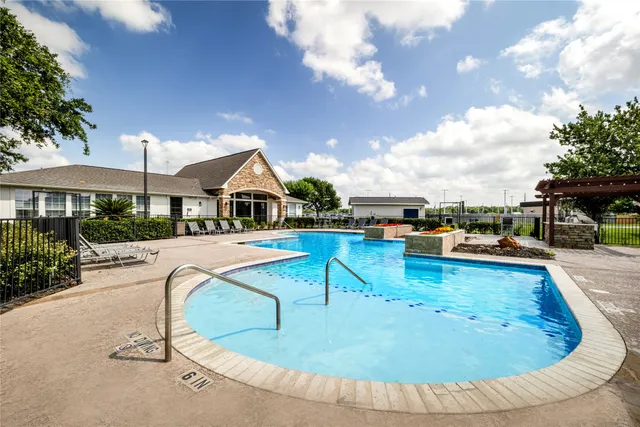 a view of a swimming pool with lounge chair