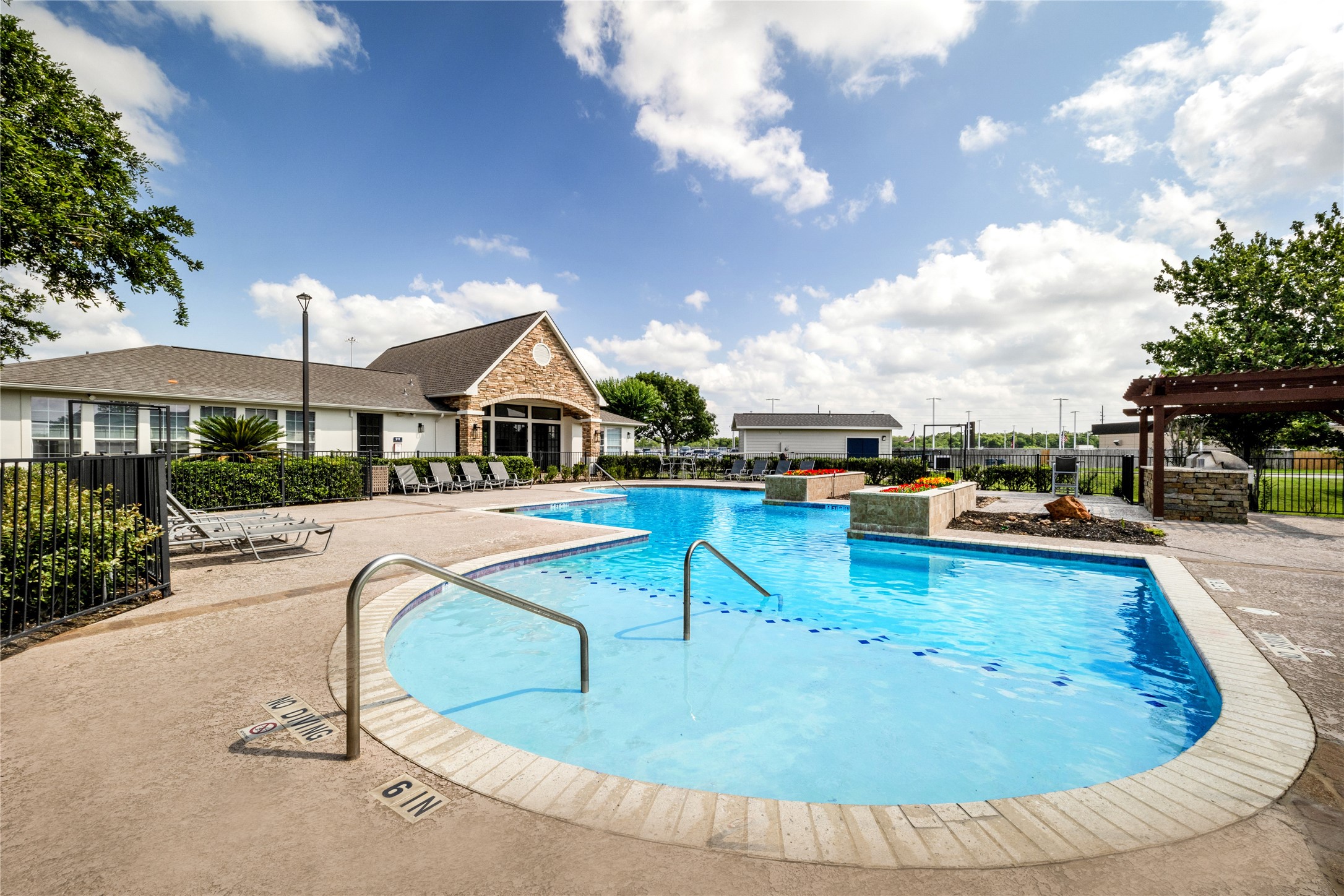 3419 Fountains Drive, Unit 1506 Rosenberg, TX 77471 - Photo 1 of 10 a view of a swimming pool with lounge chair