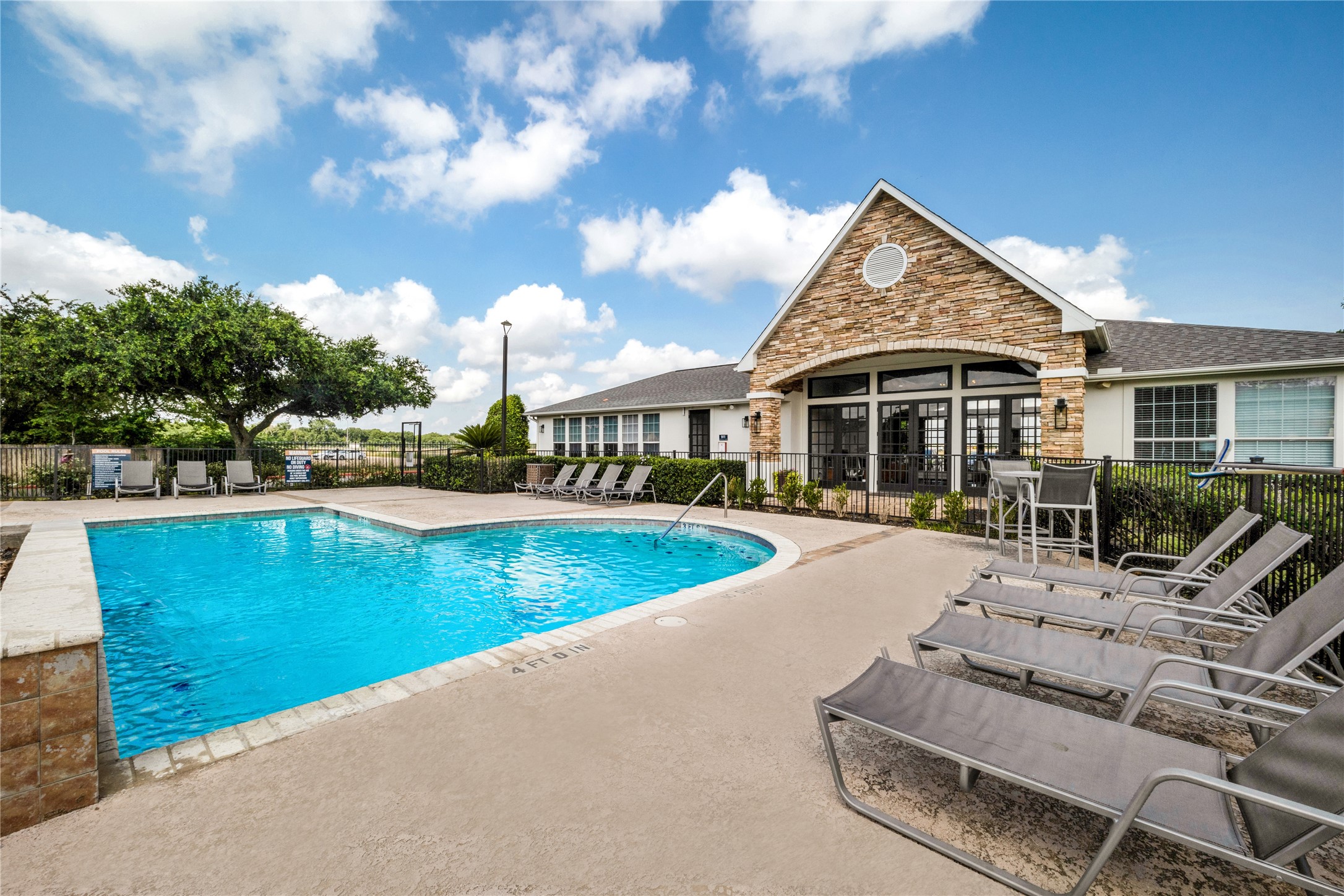 3419 Fountains Drive, Unit 1506 Rosenberg, TX 77471 - Photo 2 of 10 a view of a house with swimming pool and sitting area