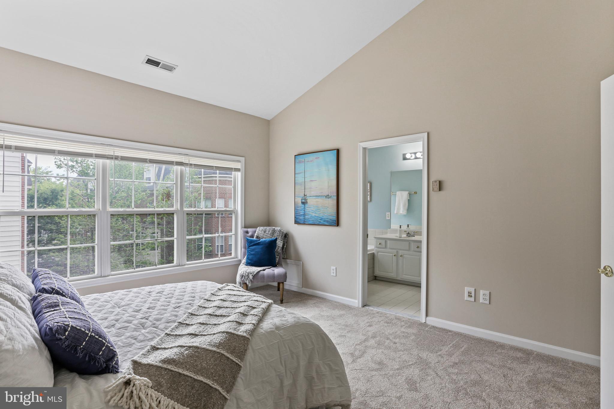 10232 Rutland Round Road, Unit 24 Columbia, MD 21044 - Photo 14 of 31 a bedroom with a bed and glass window