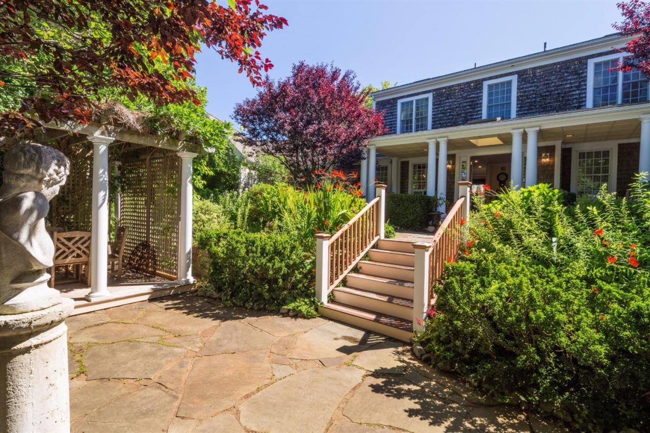 25 Sawyer Grove Road Truro, MA 02666 - Photo 3 of 34 a view of a house with brick walls and potted plants