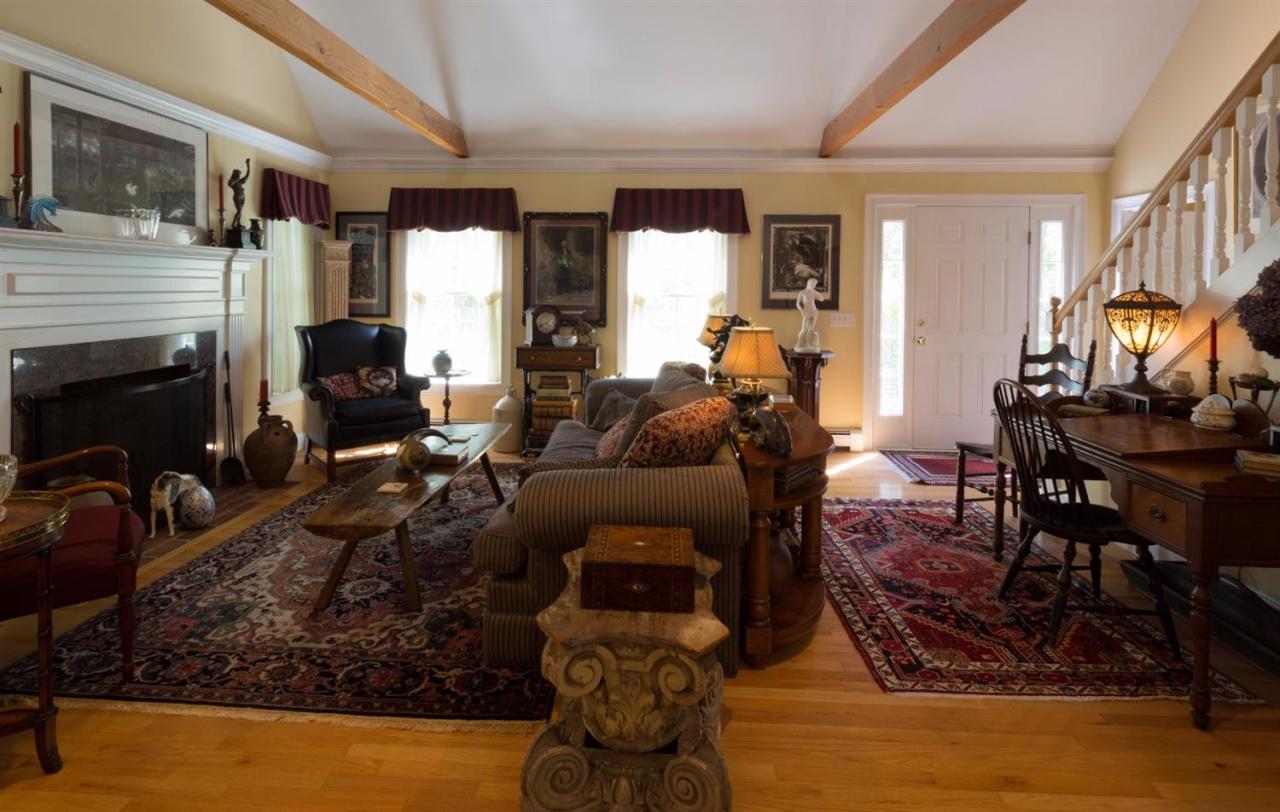 25 Sawyer Grove Road Truro, MA 02666 - Photo 8 of 34 a living room with furniture or couch and a fireplace