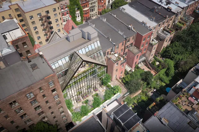 a front view of a house with plants