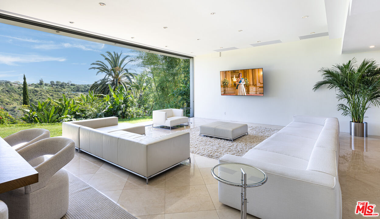 1466 Bel Air Road Los Angeles, CA 90077 - Photo 12 of 35 a living room with furniture and a large window