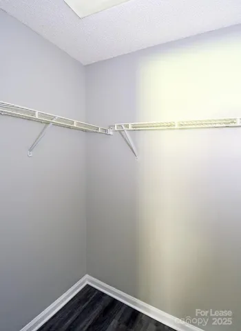 a view of an empty walk in closet
