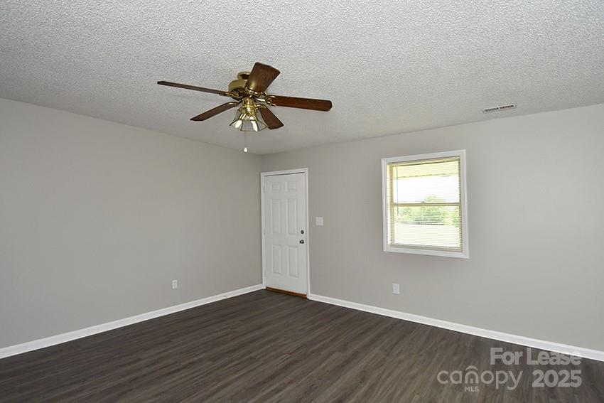 150 Glen-Gar Drive Lincolnton, NC 28092 - Photo 4 of 16 a view of room with wooden floor and windows