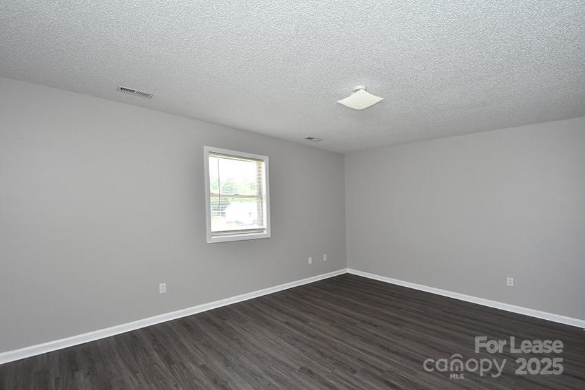 150 Glen-Gar Drive Lincolnton, NC 28092 - Photo 8 of 16 wooden floor in an empty room with a window