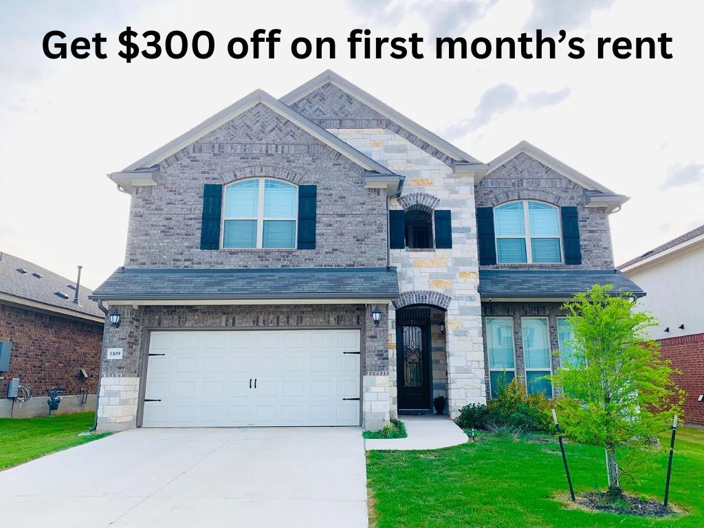 a view of a house with a small yard
