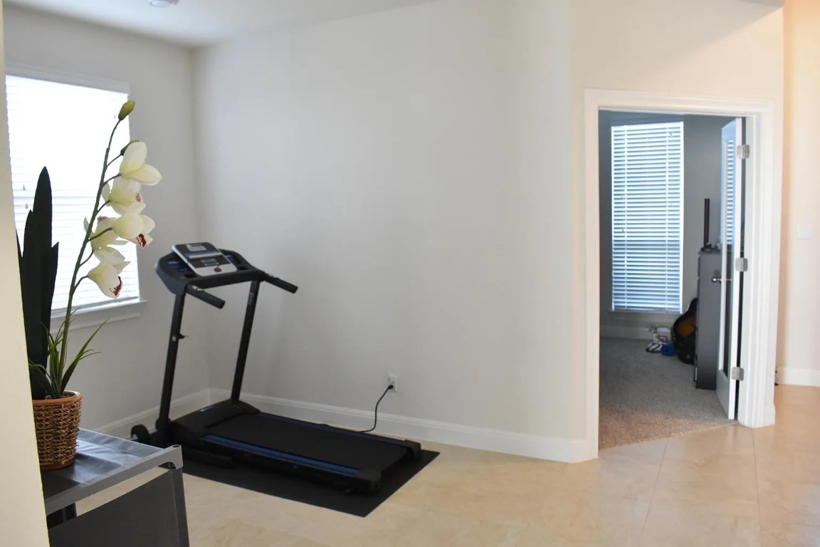 1109 Sundrops Street Leander, TX 78641 - Photo 16 of 40 a view of a room with gym equipment
