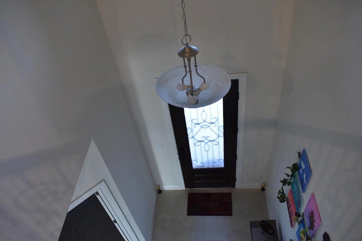 1109 Sundrops Street Leander, TX 78641 - Photo 17 of 40 a view of a hallway to a livingroom with furniture window and hallway