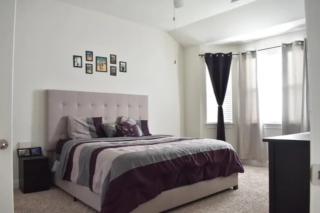 a view of a hallway to a livingroom with furniture window and hallway