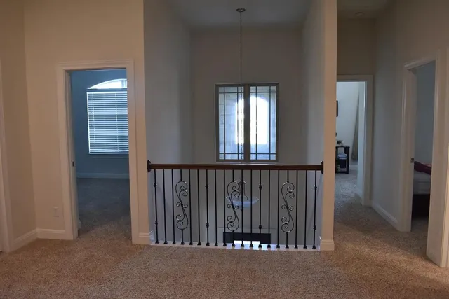 a view of a hallway with windows