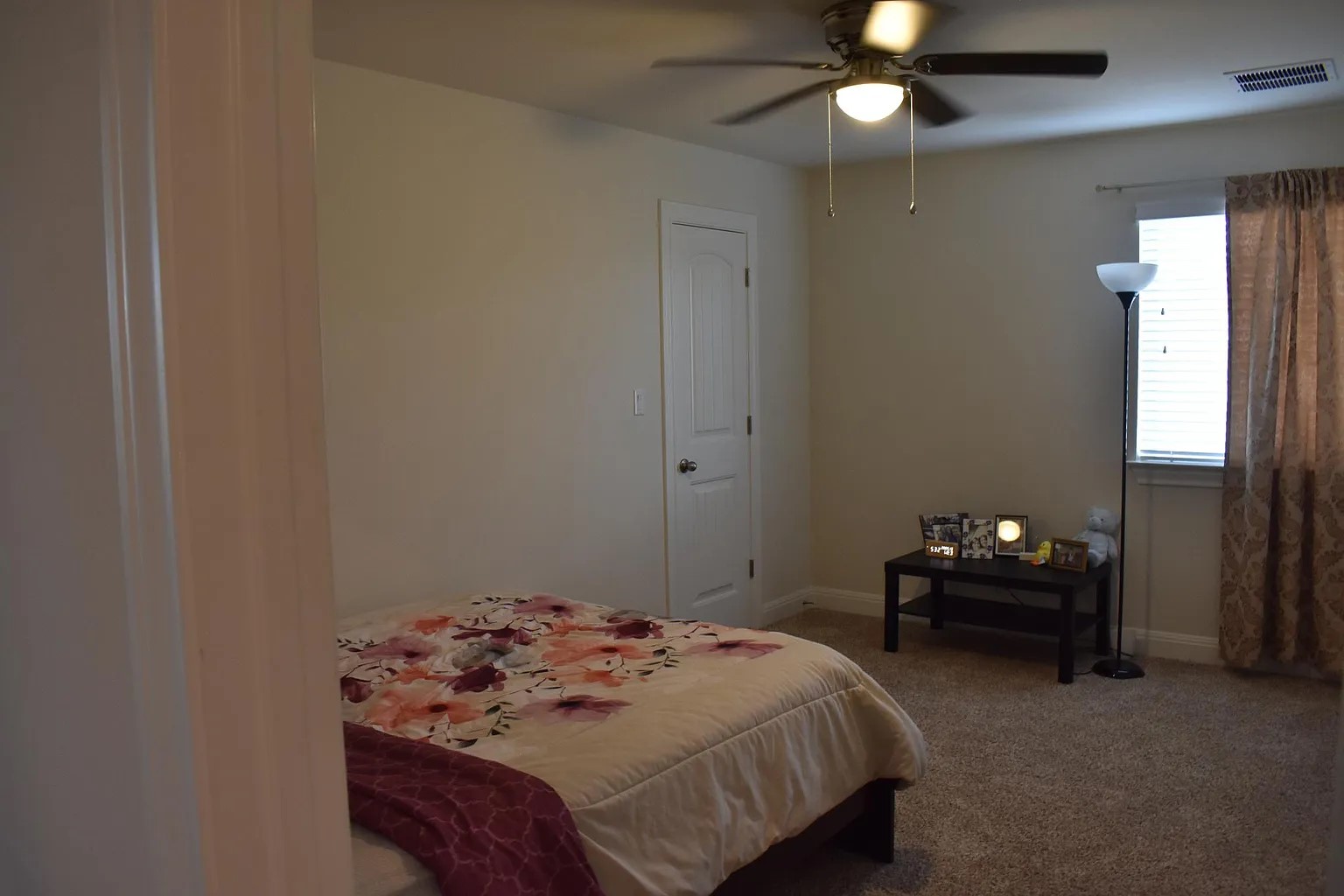 1109 Sundrops Street Leander, TX 78641 - Photo 28 of 40 a bedroom with a bed and a chandelier