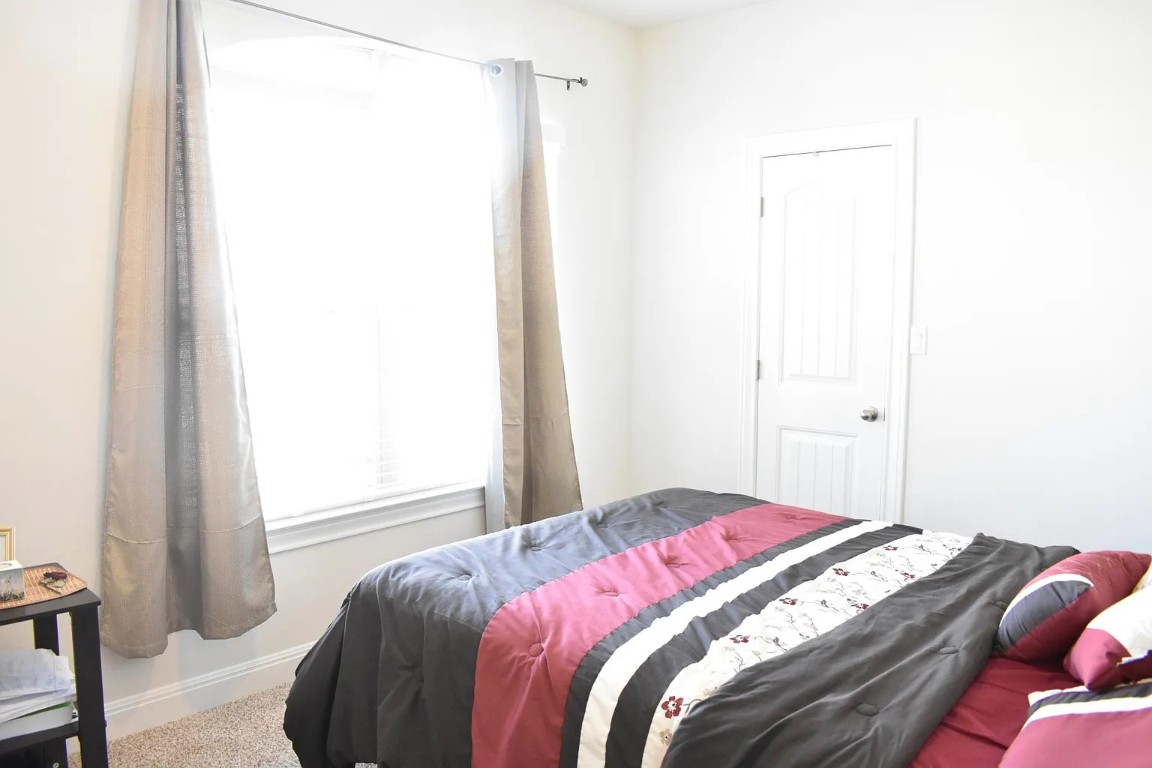 1109 Sundrops Street Leander, TX 78641 - Photo 31 of 40 a bedroom with a bed and a window