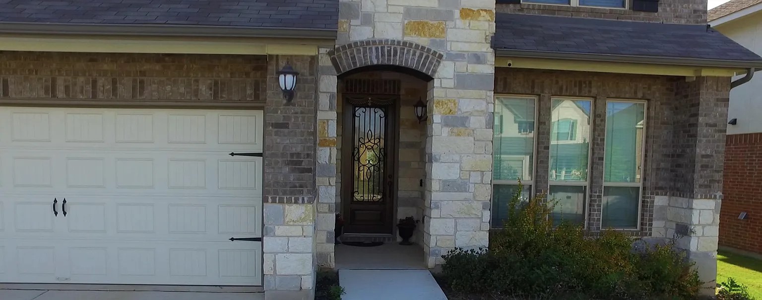 1109 Sundrops Street Leander, TX 78641 - Photo 37 of 40 a view of a entryway door of the house
