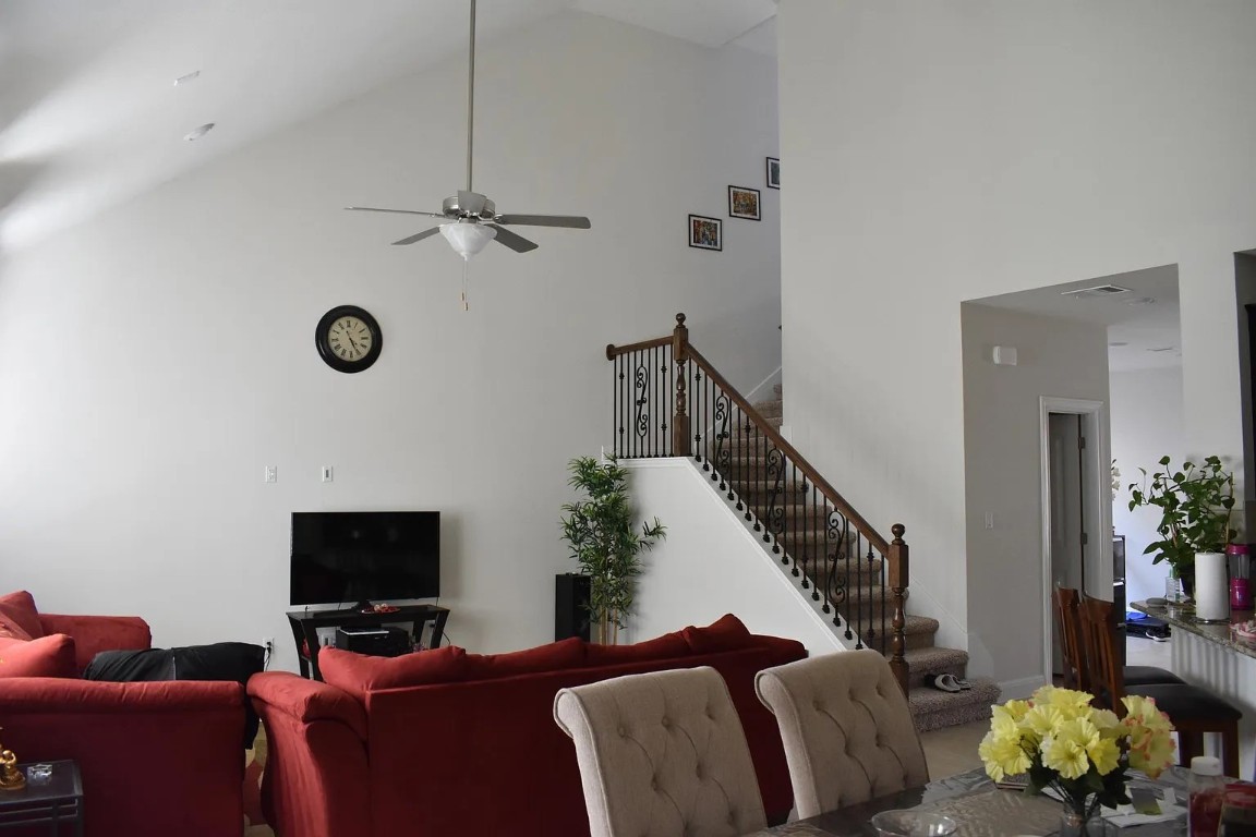 1109 Sundrops Street Leander, TX 78641 - Photo 5 of 40 a living room with furniture and a flat screen tv