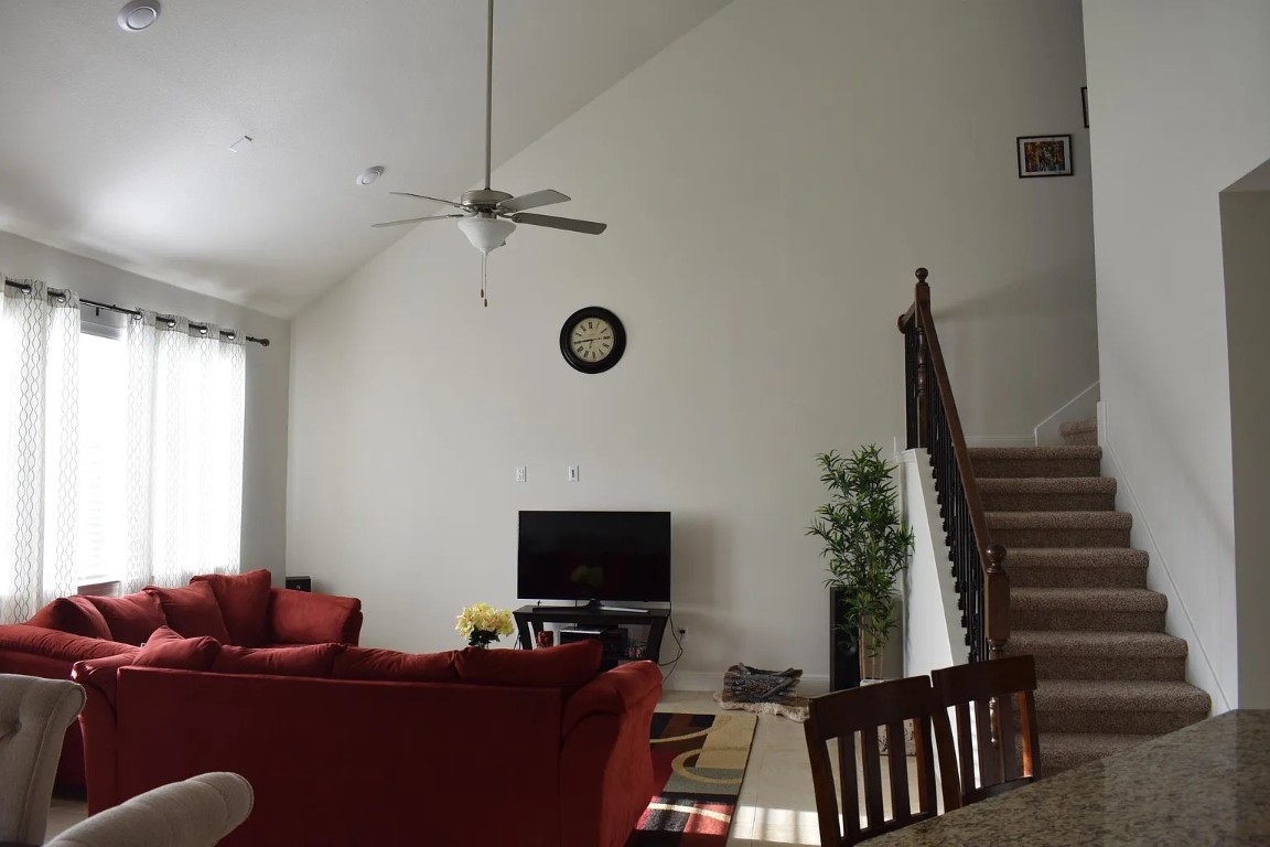 1109 Sundrops Street Leander, TX 78641 - Photo 9 of 40 a living room with furniture and a flat screen tv