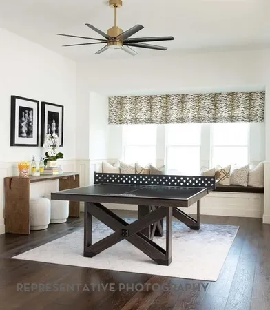a living room with furniture a window and a table
