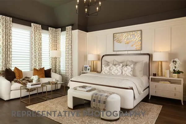 a bedroom with furniture and a large window