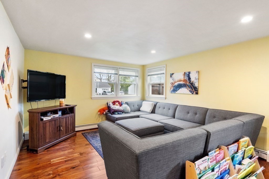 14 Rutledge Road Natick, MA 01760 - Photo 12 of 39 a living room with furniture and a flat screen tv