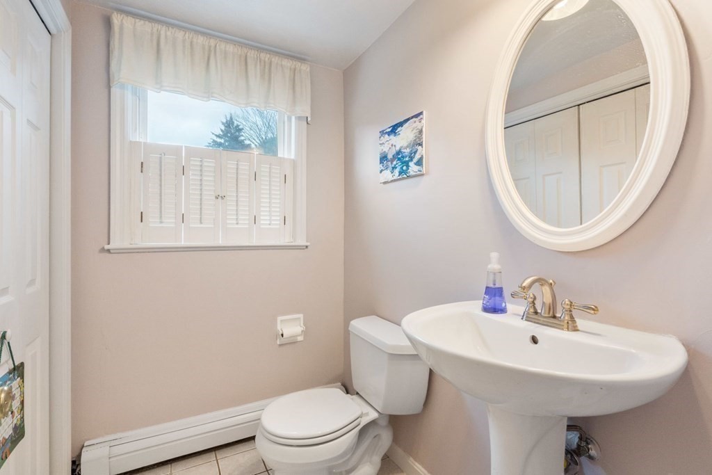 14 Rutledge Road Natick, MA 01760 - Photo 15 of 39 a bathroom with a sink toilet and a mirror