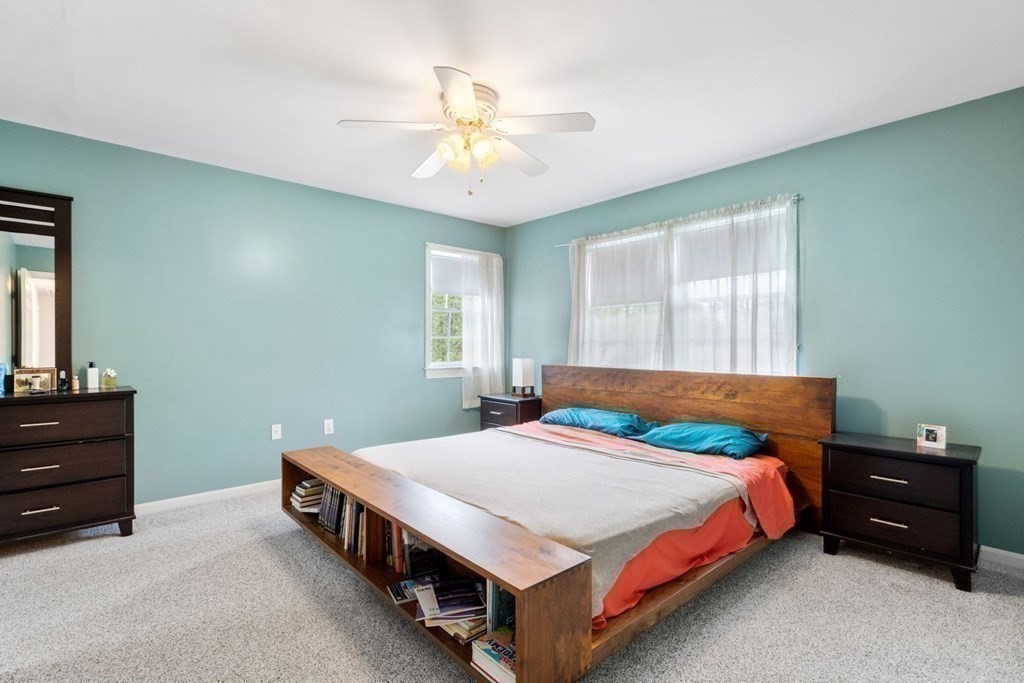 14 Rutledge Road Natick, MA 01760 - Photo 16 of 39 a bedroom with a bed and a chandelier