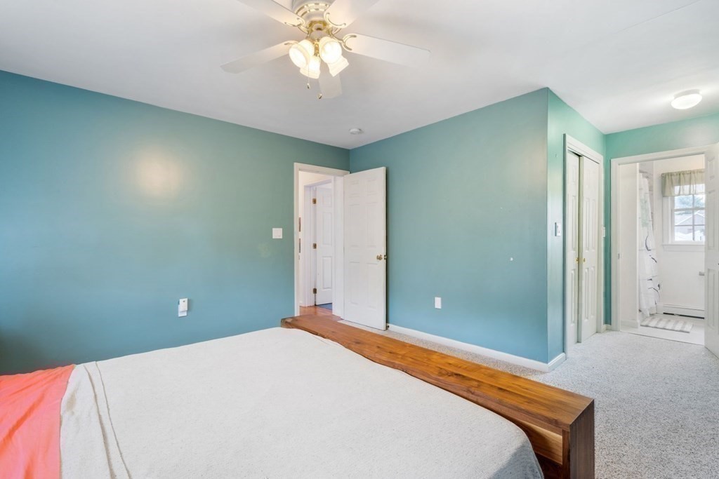 14 Rutledge Road Natick, MA 01760 - Photo 18 of 39 a bedroom with a bed and a chandelier