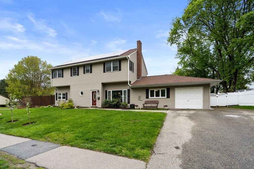 14 Rutledge Road Natick, MA 01760 - Photo 2 of 39 a front view of a house with a garden