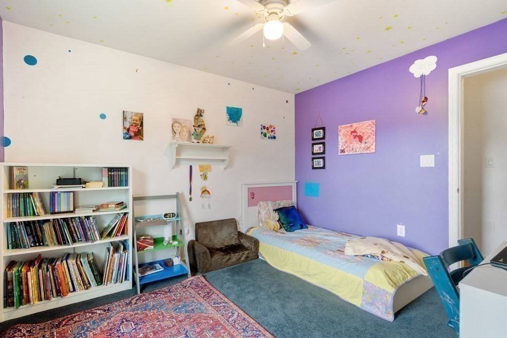14 Rutledge Road Natick, MA 01760 - Photo 22 of 39 a bedroom with furniture and a book shelf