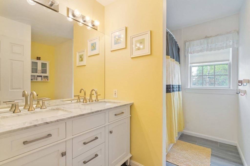 14 Rutledge Road Natick, MA 01760 - Photo 23 of 39 a bathroom with a granite countertop sink mirror and a