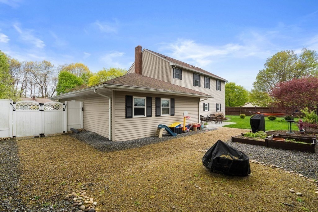 14 Rutledge Road Natick, MA 01760 - Photo 28 of 39 a view of a house with backyard and sitting area