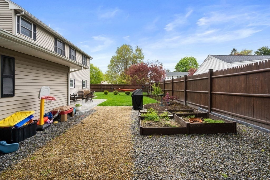 14 Rutledge Road Natick, MA 01760 - Photo 29 of 39 a view of a house with backyard and sitting area